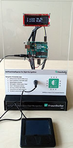 AIfES demonstrator for handwriting recognition. All functions have been integrated on the Arduino UNO, which reads the sensor values of the touchpad, performs number recognition and outputs the result to the display.